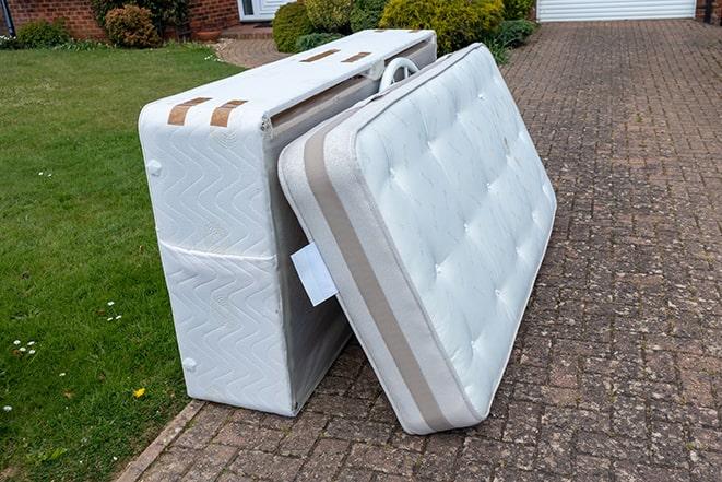 old mattress being taken away for recycling